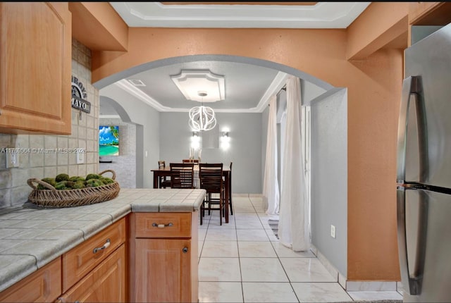 30328 SW 158th Pl, Homestead, FL 33033 - kitchen featuring glass insert cabinets, a sink, ornamental molding, freestanding refrigerator, and decorative backsplash
