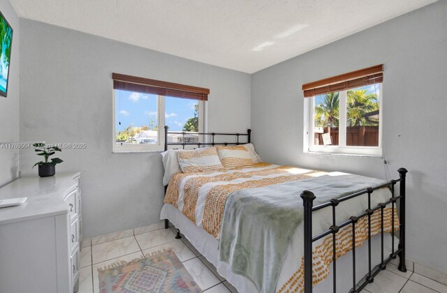 30328 SW 158th Pl, Homestead, FL 33033 - bedroom with light tile patterned floors and a closet