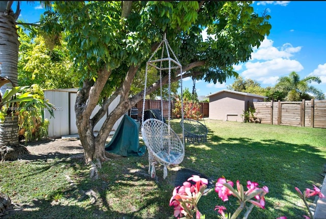 30328 SW 158th Pl, Homestead, FL 33033 - view of yard with an outbuilding, a storage unit, and a fenced backyard