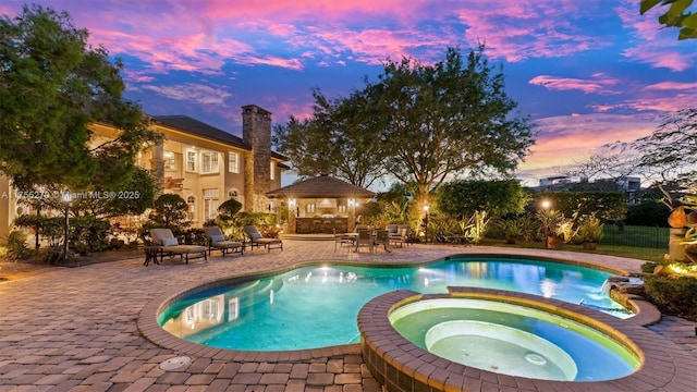 12483 Grand Oaks Dr, Davie, FL 33330 - view of swimming pool with a patio area and a pool with connected hot tub