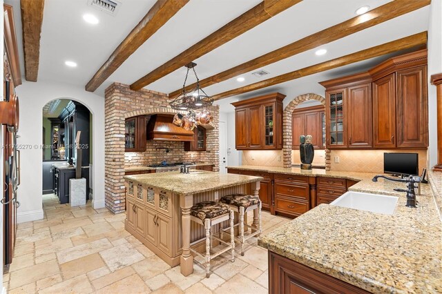 12483 Grand Oaks Dr, Davie, FL 33330 - kitchen with a sink, backsplash, light stone counters, premium range hood, and recessed lighting