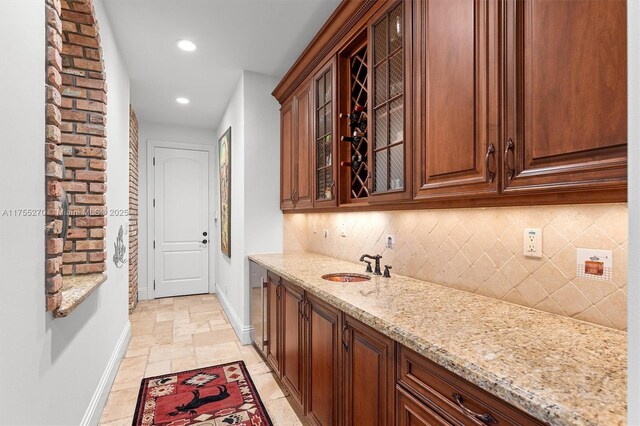 12483 Grand Oaks Dr, Davie, FL 33330 - indoor wet bar with baseboards, tasteful backsplash, stone tile floors, and recessed lighting