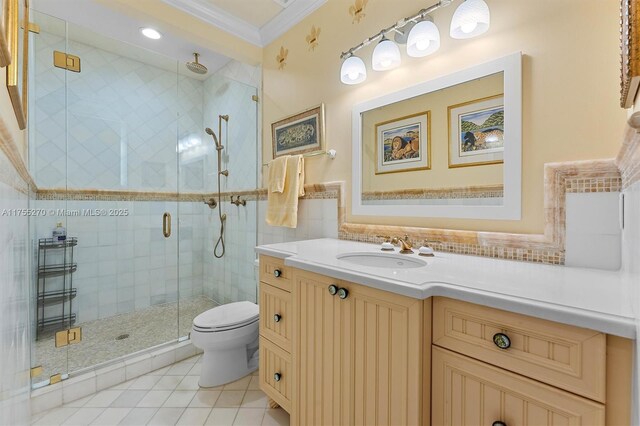 12483 Grand Oaks Dr, Davie, FL 33330 - bathroom with ornamental molding, tile patterned floors, toilet, vanity, and a stall shower