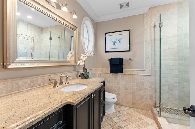 12483 Grand Oaks Dr, Davie, FL 33330 - bathroom featuring a stall shower, vanity, tile walls, toilet, and tile patterned floors