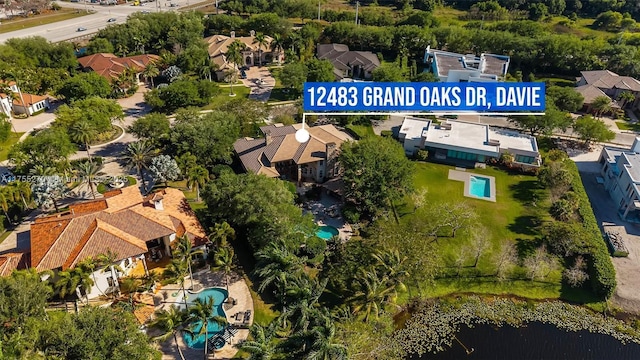12483 Grand Oaks Dr, Davie, FL 33330 - aerial perspective of suburban area with a pool