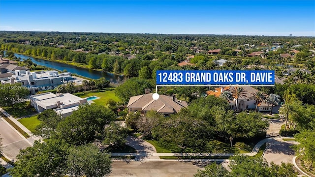12483 Grand Oaks Dr, Davie, FL 33330 - aerial view of residential area with a large body of water