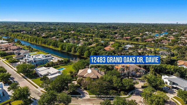 12483 Grand Oaks Dr, Davie, FL 33330 - aerial perspective of suburban area featuring a nearby body of water