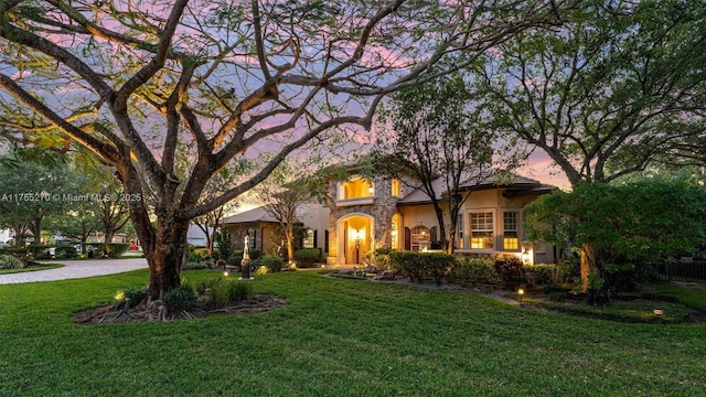 12483 Grand Oaks Dr, Davie, FL 33330 - view of front of home with a lawn and stucco siding