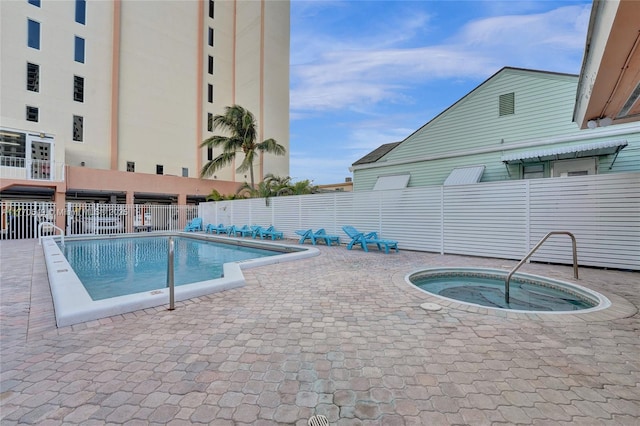 801 S Ocean Dr Unit 604, Hollywood, FL 33019 - community pool featuring a patio, fence, and a hot tub