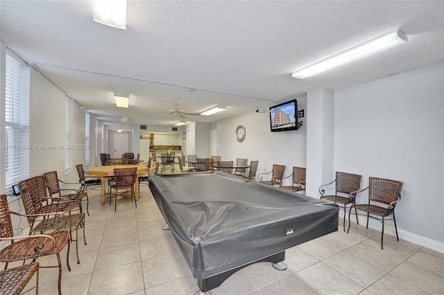 801 S Ocean Dr Unit 604, Hollywood, FL 33019 - rec room with light tile patterned flooring, a ceiling fan, a textured ceiling, billiards, and baseboards