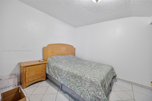 bedroom featuring light tile patterned floors