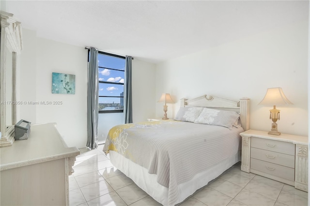 bedroom featuring light tile patterned floors