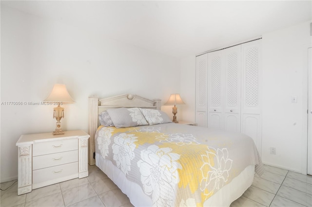 bedroom featuring light tile patterned flooring and a closet