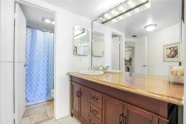 full bathroom with a shower with shower curtain, toilet, vanity, tile patterned flooring, and visible vents