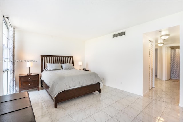 bedroom featuring visible vents