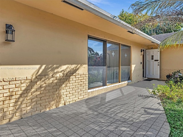 5404 Bayberry Ln, Tamarac, FL 33319 - doorway to property with brick siding and stucco siding