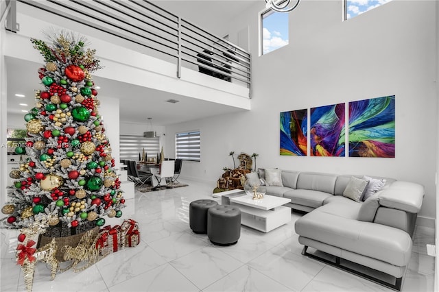 15738 SW 92nd St, Miami, FL 33196 - living room featuring a high ceiling, marble finish floor, and plenty of natural light