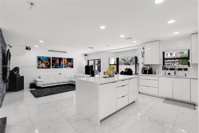 15738 SW 92nd St, Miami, FL 33196 - kitchen featuring white cabinetry, light countertops, a sink, and modern cabinets