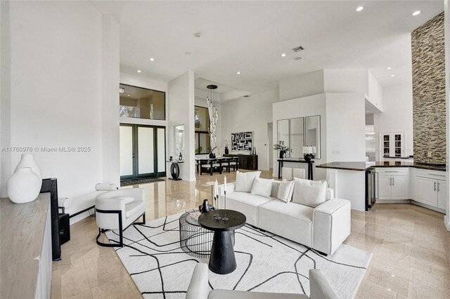3320 Bridle Path Ln, Weston, FL 33331 - living room featuring a towering ceiling, recessed lighting, and light marble finish floors