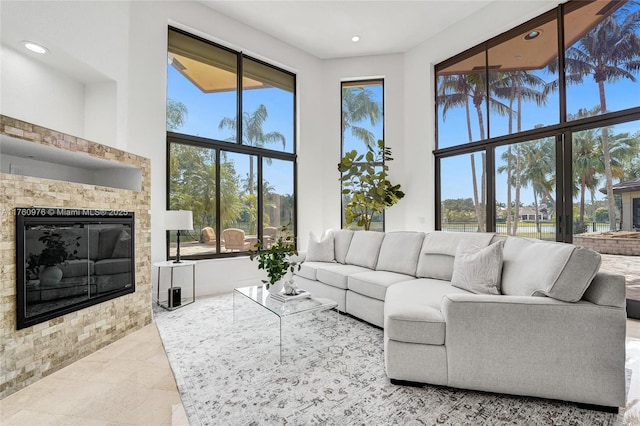 3320 Bridle Path Ln, Weston, FL 33331 - living room with a glass covered fireplace and recessed lighting