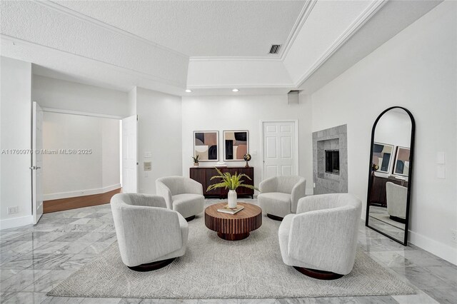 3320 Bridle Path Ln, Weston, FL 33331 - living area featuring marble look tile flooring, a premium fireplace, recessed lighting, and crown molding