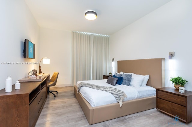 bedroom with light wood-type flooring