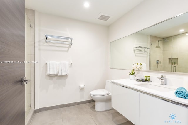 bathroom featuring toilet, visible vents, tile patterned floors, and a shower stall