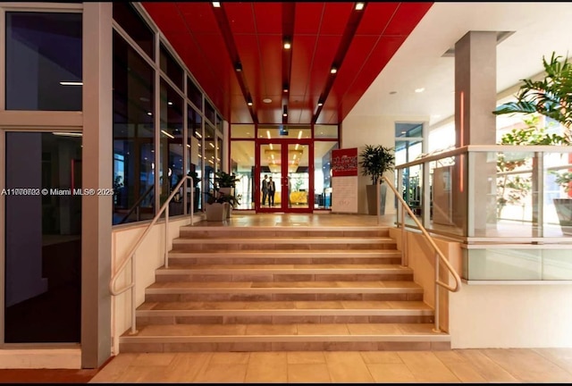stairs with french doors