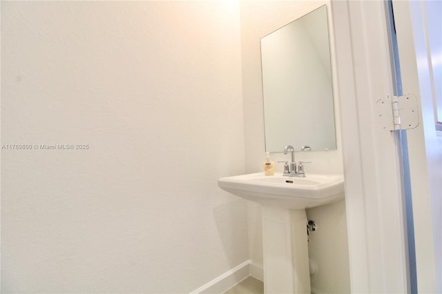 bathroom featuring baseboards