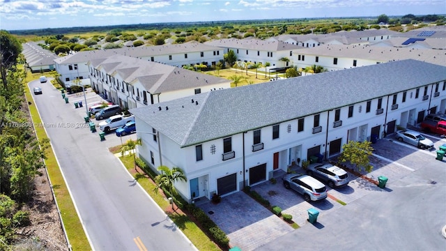 birds eye view of property with a residential view