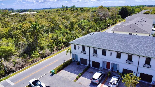 drone / aerial view with a view of trees