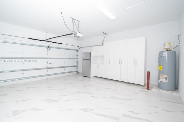 garage featuring a garage door opener, electric water heater, and freestanding refrigerator