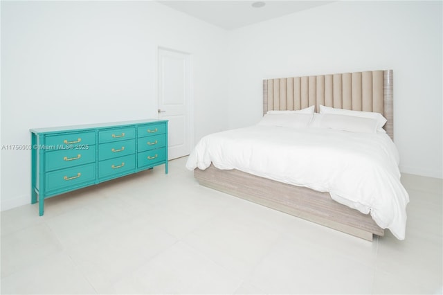 bedroom featuring baseboards