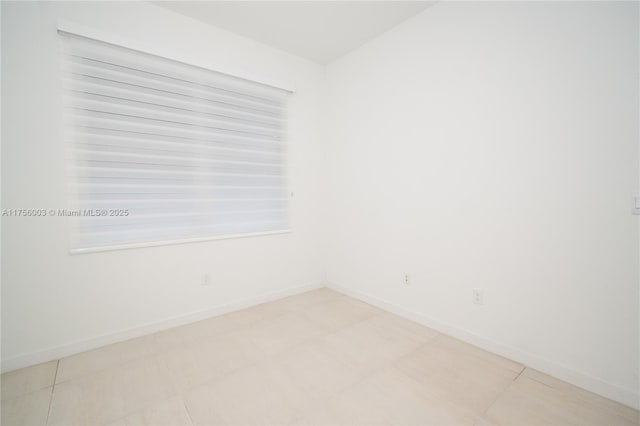 empty room with baseboards