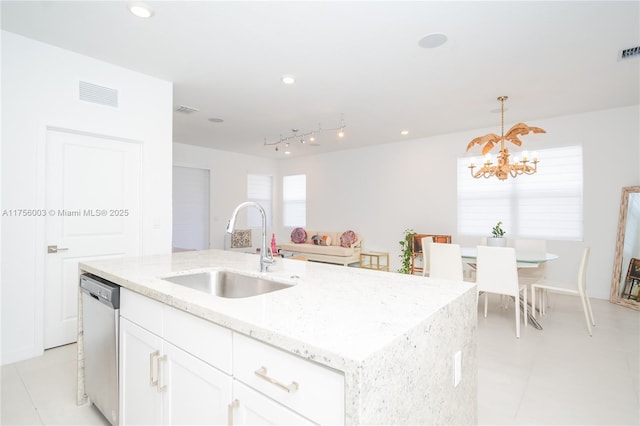 kitchen featuring a sink, white cabinetry, dishwasher, visible vents, and an inviting chandelier
