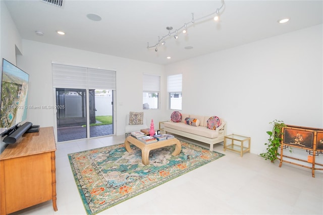 tiled living room featuring rail lighting, visible vents, and recessed lighting