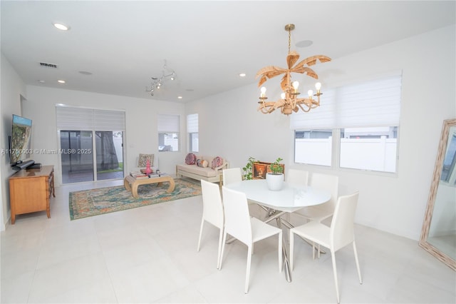 dining room featuring a notable chandelier, visible vents, and recessed lighting