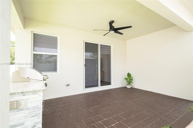 view of patio / terrace featuring a ceiling fan