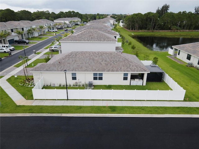 exterior space featuring a water view and a residential view