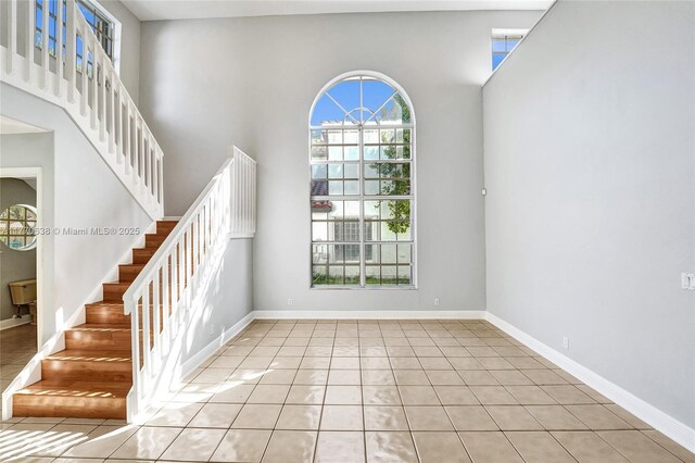 2791 La Paz Ave, Cooper City, FL 33026 - foyer entrance featuring a towering ceiling, stairway, and light tile patterned floors