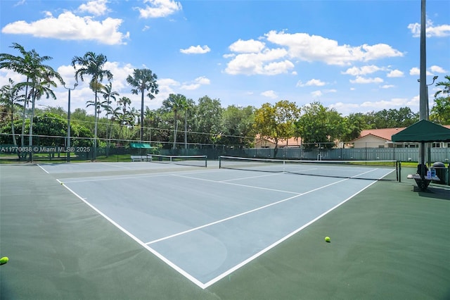 view of sport court featuring fence and community basketball court