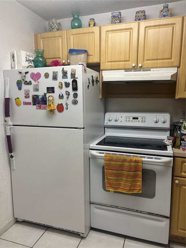 9350 Fontainebleau Blvd Unit 312, Miami, FL 33172 - kitchen featuring white appliances, under cabinet range hood, light tile patterned floors, and a textured wall