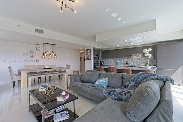 living area featuring visible vents, recessed lighting, a chandelier, and light tile patterned floors