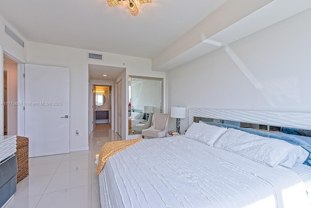 bedroom with light tile patterned flooring and visible vents
