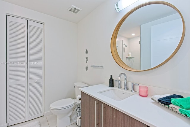 bathroom featuring recessed lighting, visible vents, toilet, vanity, and a closet