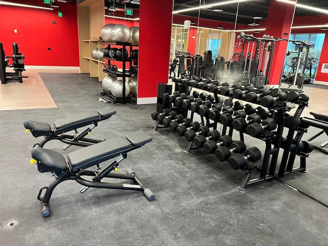 workout area featuring baseboards