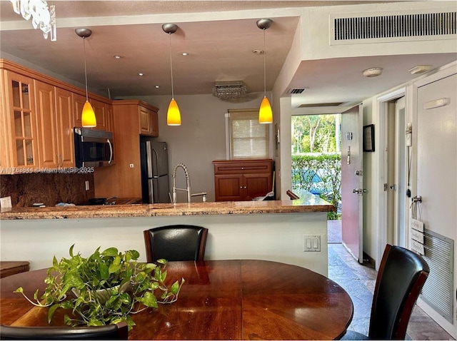 3301 N Country Club Dr Unit 110, Aventura, FL 33180 - kitchen with a sink, visible vents, a peninsula, appliances with stainless steel finishes, and glass insert cabinets