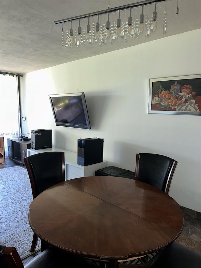 3301 N Country Club Dr Unit 110, Aventura, FL 33180 - dining space featuring rail lighting and expansive windows