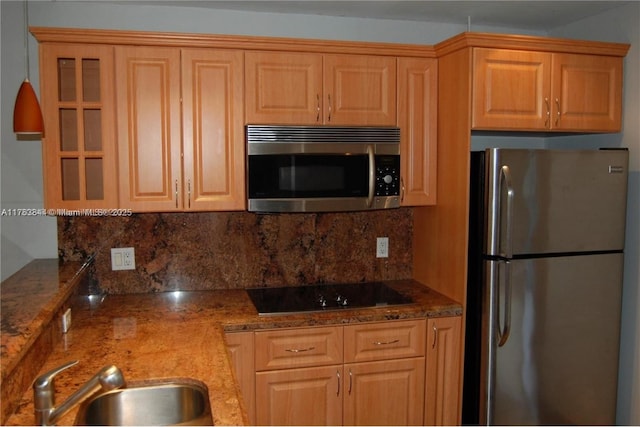 3301 N Country Club Dr Unit 110, Aventura, FL 33180 - kitchen featuring decorative backsplash, appliances with stainless steel finishes, glass insert cabinets, a sink, and stone counters