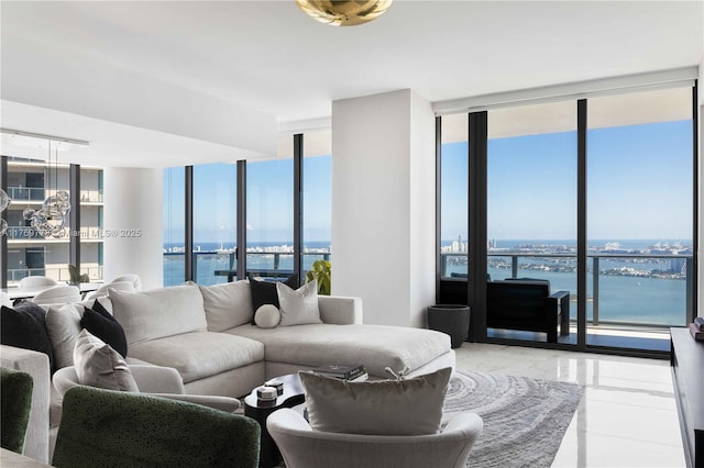 650 NE 32nd St Unit Ph5004, Miami, FL 33137 - living area with a water view and a wall of windows